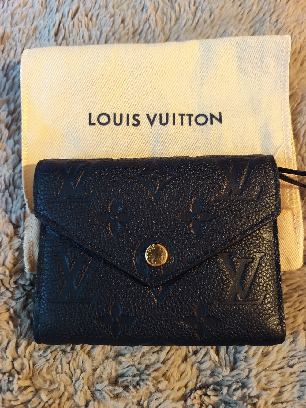  LOUIS VUITTON Empreinte Victorine Wallet in Black.